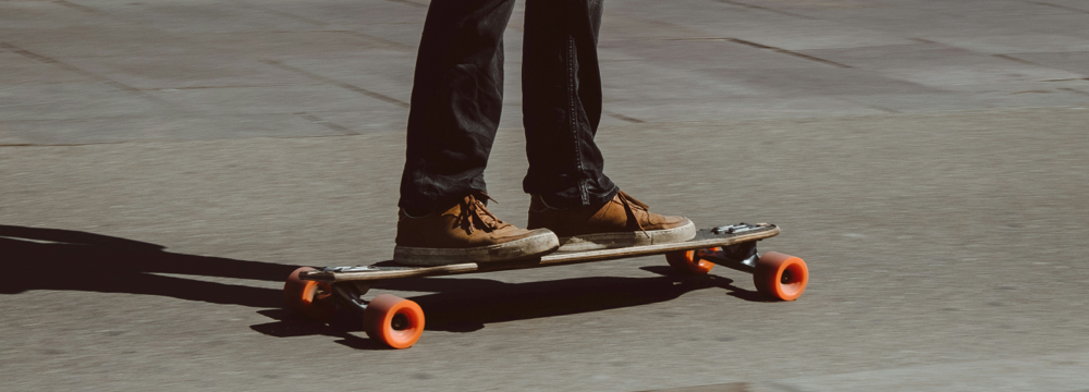 Custom Accessible WordPress Solution Redesign for Colorado State University with picture student riding longboard